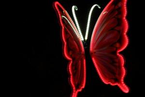 A beautifully illuminated butterfly sculpture featuring vibrant colors, perfect for adding charm to any indoor or outdoor space. photo
