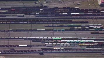 Aerial view of Railway sorting station and A lot of wagons at a railway. Drone flies over railway tracks. 4k quality video