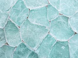 Frozen lake surface with intricate ice patterns photo
