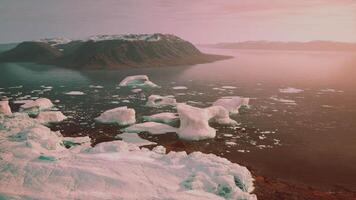 A mesmerizing view of icebergs floating on a tranquil body of water video