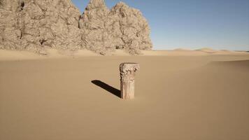 A stone pillar in the middle of a desert video