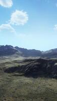 An aerial view of a mountain range in the mountains video