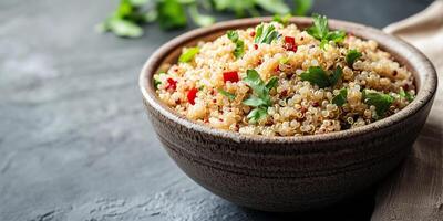 Close-up view of quinoa grains in a deep, round bowl with visible ingredients on top, food photography photo