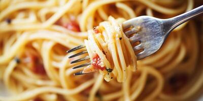 Close-up of a forkful of spaghetti carbonara with visible pasta strands and sauce, culinary photography photo