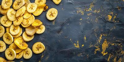 Top view of banana chips scattered on a flat surface, culinary photography photo