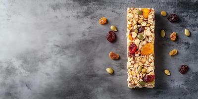 Energy bar with visible grains, seeds, and dried fruits on a flat surface, culinary photography photo