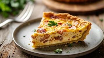 Close-up of quiche slice on a plate with visible layers and a fork nearby, food photography photo