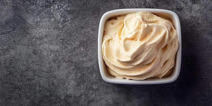 Mousse served in a square container with a uniform texture and no extra components, culinary photography photo