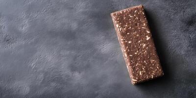 Protein bar on a flat surface with a smooth appearance, photorealistic food photo
