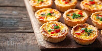 Mini quiches symmetrically arranged on a rectangular board, photorealistic food photo