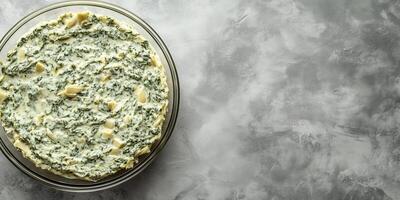Spinach artichoke dip in a transparent dish with minimalistic presentation, photorealistic food photo