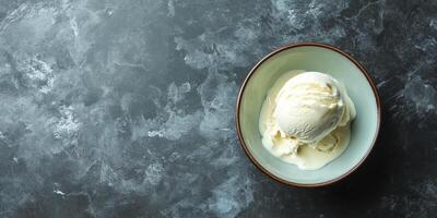 Scoop of ice cream in a bowl, creamy texture and smooth surface, food setting photo