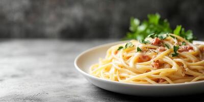 Side view of a plate of spaghetti carbonara showcasing the texture of pasta and sauce, food setting photo