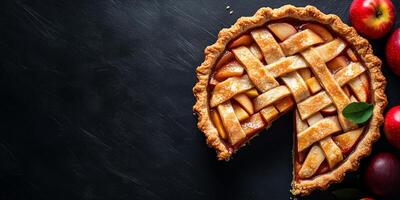 Slice of pie revealing layers of baked apples within a firm, flaky crust, food setting photo