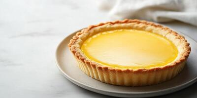 Tart with thin crust, filled with lemon curd, resting on a simple plate, meal photography photo