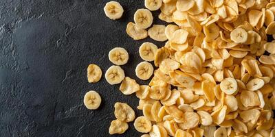 Top view of banana chips scattered on a flat surface, food setting photo