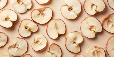 Top view of dried apple slices scattered on a flat surface, food setting photo