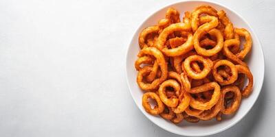 Curly fries on a white plate in circular pattern, meal photography photo