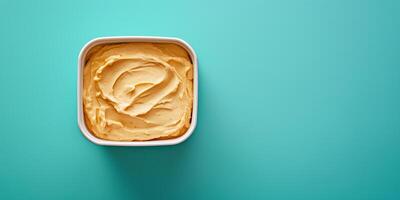 Dip in a square container with no additional elements or adornments, food setting photo