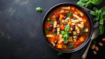 Minestrone soup in a deep bowl with visible vegetables, pasta, and beans, meal photography photo