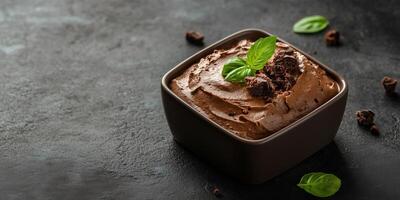 Mousse served in a square container with a uniform texture and no extra components, food setting photo