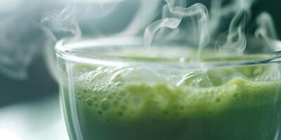 Close-up of matcha in a glass cup, steam rising from the surface, culinary photography photo