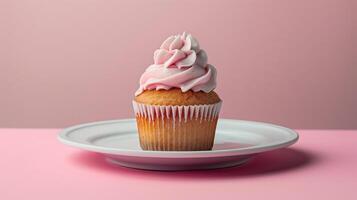 Cupcake with frosting, positioned in the center of a plain white plate, culinary photography photo