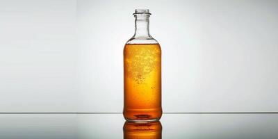 Kombucha bottle with visible fermentation sediment at the bottom, standing on a reflective surface, food photography photo