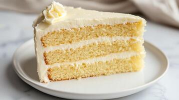 Vegan lemon cake with a smooth frosting, presented on a white ceramic plate, culinary photography photo