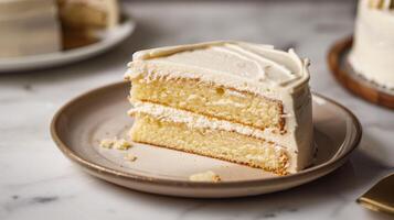 Whole cake with thin icing layer on a simple plate and a visible slice cut out, food photography photo