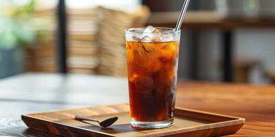 Cold brew in a tall glass with a stainless steel straw on a wooden tray, food photography photo