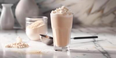 Glass filled with meal replacement shake, with the powder container and scoop in the background, meal photography photo