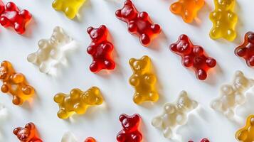 Different colored gummy bears clustered on a clean white background, food setting photo