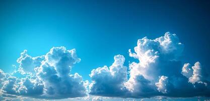 The sky is blue with a few clouds scattered throughout. The clouds are white and fluffy, giving the sky a peaceful and serene appearance photo