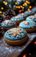 A row of blue and white cookies with snowflakes on them. The cookies are decorated with white icing and sprinkles photo
