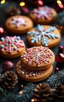 A close up of a plate of cookies with snowflake designs on them. The cookies are stacked on top of each other and are surrounded by pine cones and red ornaments. The image conveys a festive photo