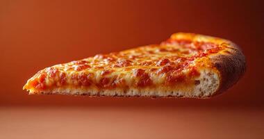 A slice of pizza is shown in the air, with the crust and cheese visible. The slice is cut in half, and the cheese is melted and bubbly. Concept of indulgence and enjoyment photo