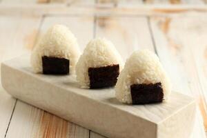 Triangle Onigiri, Rice Balls with Nori. photo