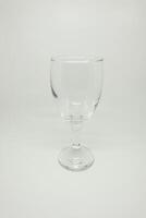 A glass of wine on a white surface photo