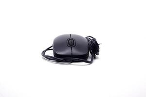 A black computer mouse on a white surface photo