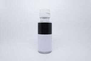A white and black bottle with a white cap photo