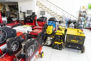 BAKU, AZERBAIJAN - May 20, 2022. Electrical equipment, high-pressure devices for washing cars by Omax are on sale in the store photo