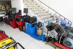 BAKU, AZERBAIJAN - May 20, 2022. Electrical equipment, high-pressure devices for washing cars by Omax are on sale in the store photo