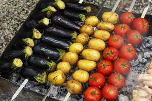 delicious grilled vegetables ,mushrooms, tomato, zucchini, potato photo