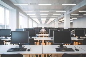 Spacious room with rows of desks and large windows letting in natural light photo