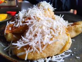 Fried bananas with cheese topping photo