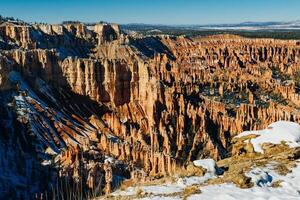 Wide angle view of Bryce Canyon with snow National Park at Sunrise, Colorado, USA photo