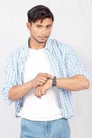 A man in a blue shirt and white shirt photo