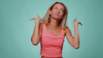 Funny joyful woman making playful silly facial expressions, grimacing, fooling around showing tongue video
