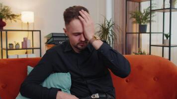 Young guy at home suffers from unfair situation problem, break up, depressed, feeling bad, burnout video